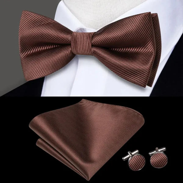brown bow ties with matching cuff links and pocket square