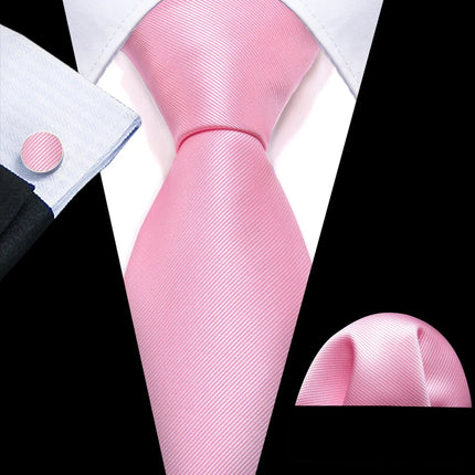 collection of pink ties with matching cufflinks and pocket square