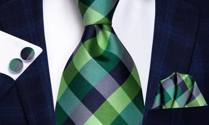 green and blue check pattern tie with matching cuff links and pocket square