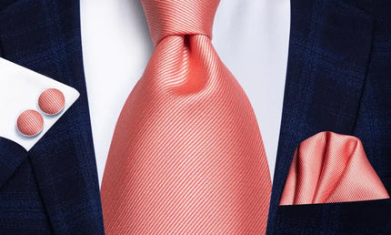 pink textured design tie with matching cuff links and pocket square
