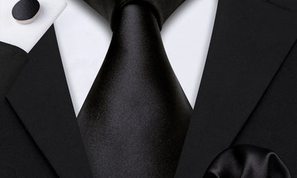 plain black tie with matching cuff links and pocket square
