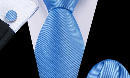 plain blue tie with matching cuff links and pocket square