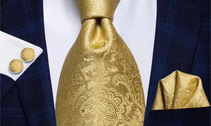 plain gold paisley tie with cuff links and pocket square