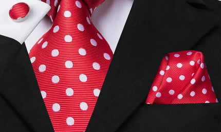 red and white polka dot tie with cuff links and pocket square