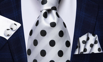 silver and black polka dot pattern tie with matching cuff links and pocket square